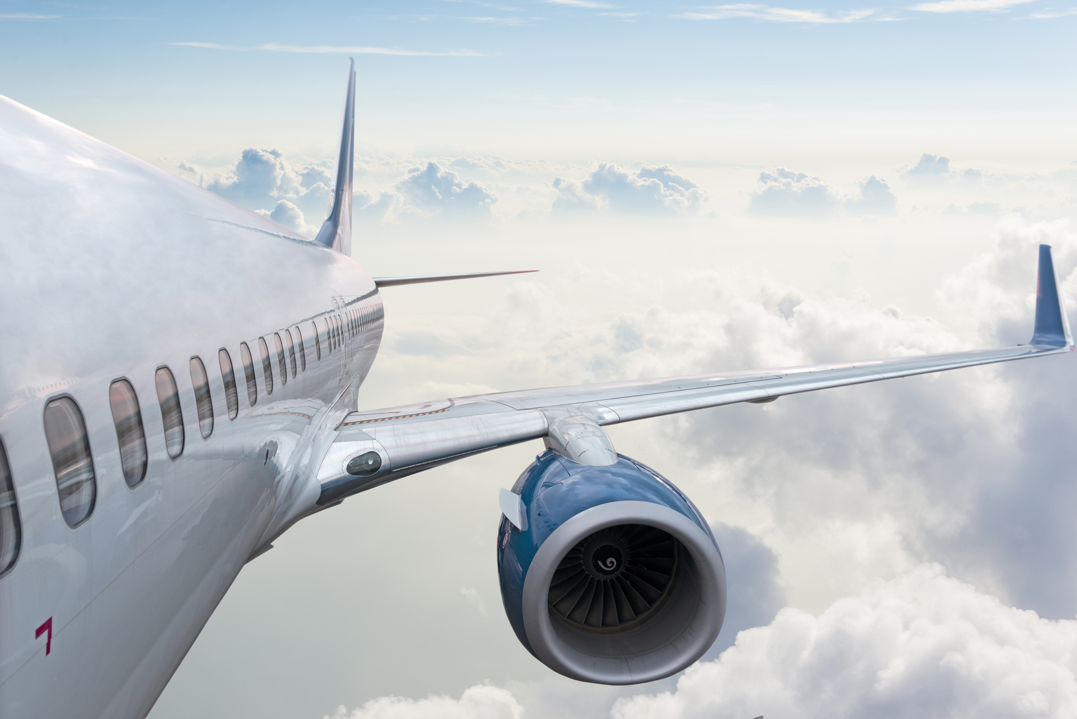 Photo of the wing of an airplane mid-flight