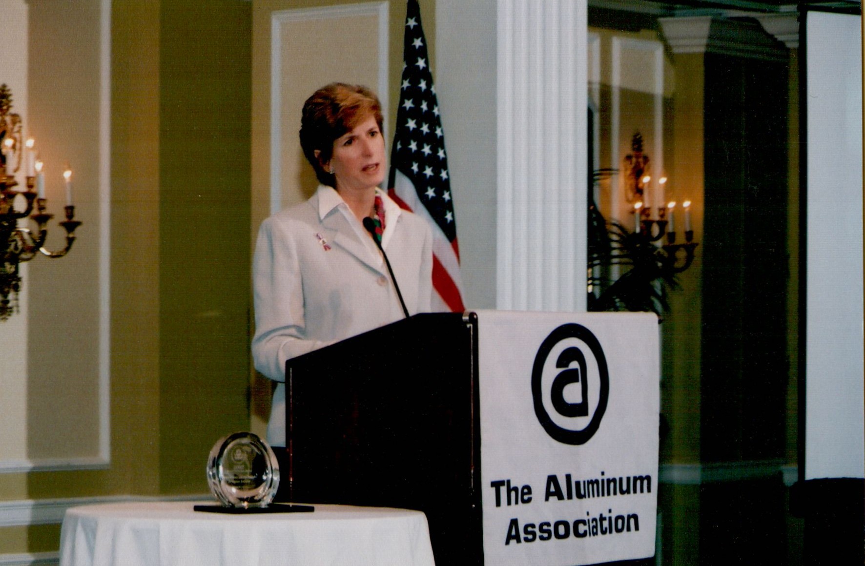 A woman speaks at a podium